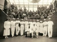 Historical photo of doctors and medical staff in an operating room.